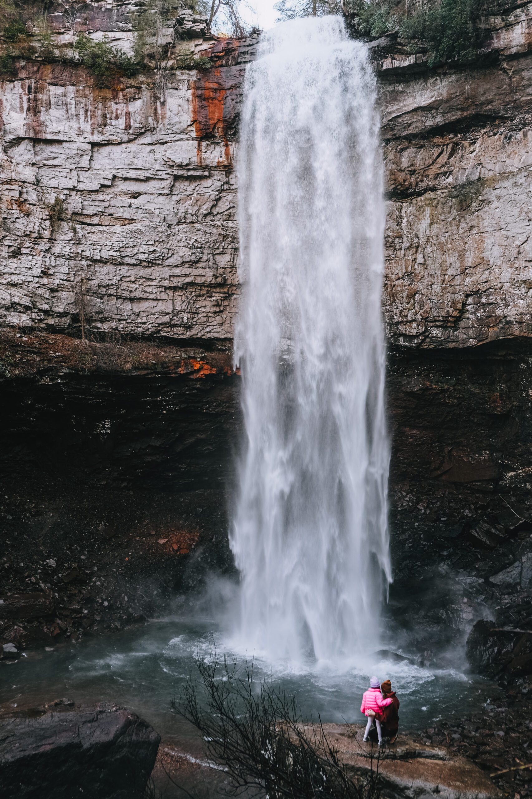 Woman and small child viewing the waterfall at the base of Fall Creek Falls